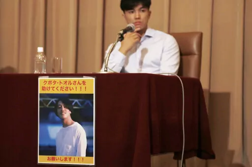 An image of Toru Kubota, a Japanese journalist detained in Myanmar while covering a protest, is displayed at the Japan Press Club in Tokyo on Aug. 3, 2022 as his friends gathered at the club calling for his immediate release. Diplomat says Myanmar court gives 10-year prison sentence to Japanese journalist who filmed anti-government protest. (AP Photo/Yuri Kageyama, File)