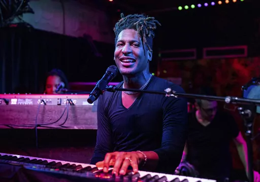 Jon Batiste performs at the Maple Leaf Bar in New Orleans on May 2, 2023. The singer-songwriter and multi-instrumentalist releases his latest album “World Music Radio” on Aug. 18. (Photo by Amy Harris/Invision/AP, File)