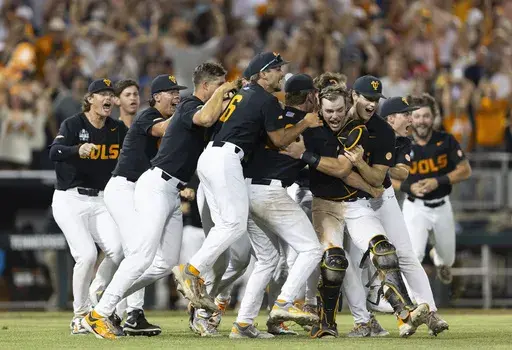 Tennessee players celebrate their 6-5 victory against Texas A&M in Game 3 of the NCAA College World Series baseball finals in Omaha, Neb., June 24, 2024. (AP Photo/Rebecca S. Gratz, File)