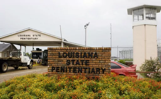 Vehicles enter the main security gate at the Louisiana State Penitentiary — Angola Prison, the largest high-security prison in the country in Angola, La., Aug. 5, 2008. In a federal court filing dated Monday, July 17, 2023, advocates said that juveniles held in a former death row building at the Louisiana prison for adults are suffering through dangerous heat and psychologically damaging isolation in their cells with little or no mental health care, inadequate schooling and foul water. In the 