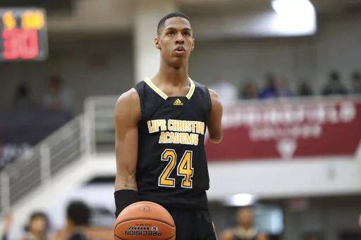 Life Christian Academy's Hansel Enmanuel Donato gets ready to shoot againsts Wilbraham and Monson during a high school basketball game at the Hoophall Classic, Jan. 17, 2022, in Springfield, Mass. The 19-year-old Emmanuel, who lost his left arm just below his shoulder in a childhood accident, scored 5 points Saturday night, Dec. 10, 2022, for Northwestern State against Louisiana-Monroe. (AP Photo/Gregory Payan, File)