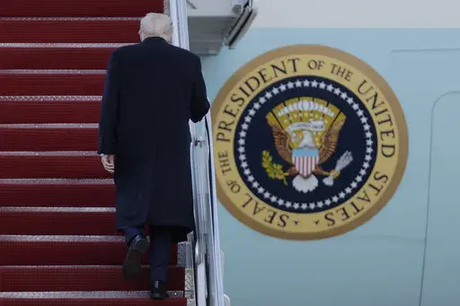 President Donald Trump walks up the stairs of Air Force One at Joint Base Andrews, Md., Friday, March 7, 2025. (AP Photo/Luis M. Alvarez)