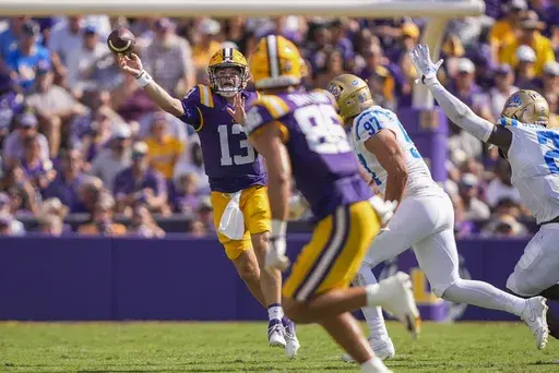 LSU quarterback Garrett Nussmeier (13) passes in the first half of an NCAA college football game against UCLA in Baton Rouge, La., Saturday, Sept. 21, 2024. (AP Photo/Gerald Herbert)