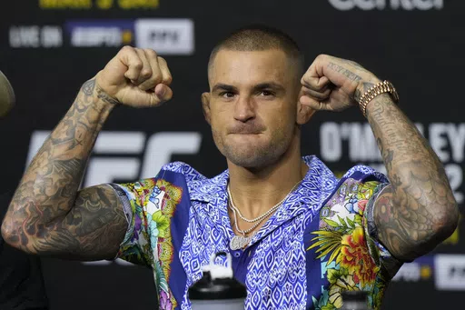 Dustin Poirier poses during a news conference UFC 299 mixed martial arts event, Thursday, March 7, 2024, in Miami. Poirier has won 30 MMA fights overall and has at least one more left - a career-defining bout on a third try at the UFC lightweight championship - against Islam Makhachev in the main event of UFC 302 on Saturday in New Jersey. (AP Photo/Wilfredo Lee, File)