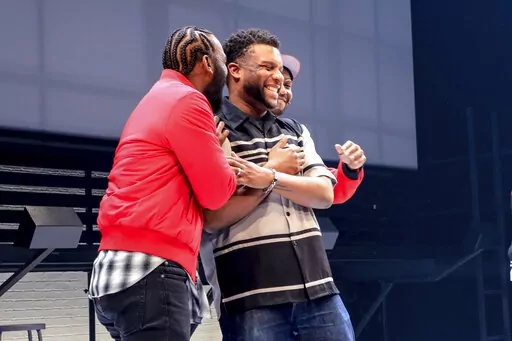 This image provided by Thoughts of a Colored Man shows Luke James, from left, playwright Keenan Scott II, and Bjorn DuPaty performing in "Thoughts of a Colored Man" on Dec. 21, 2021 in New York. (Thoughts of a Colored Man/Tricia Baron via AP)
