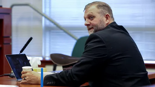 Ammon Bundy glances toward the prosecution table during a pause in his trial to clarify a line of questioning with the jury dismissed in Ada County Magistrate Judge Kim Dale's courtroom on March 15, 2022, in Boise, Idaho. A jury on Monday, July 24, 2023, awarded an Idaho hospital more than $50 million in damages in a defamation case the institution brought against far-right activist Ammon Bundy and others. (Darin Oswald/Idaho Statesman via AP, File)