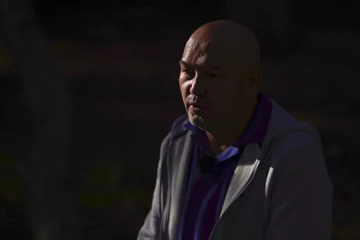 Erbakit Ortabay, 49, an ethnic Kazakh born in Xinjiang, speaks to the Associated Press, in London, Thursday, Oct. 6, 2022. A Uyghur organization and a human rights group are taking the U.K. government to court to challenge Britain’s failure to block the import of cotton products associated with forced labor and other abuses in China’s far western Xinjiang region. Erbakit Ortabay, said he was detained in internment centers, where he was tortured and beaten, and later forced to work for no pay