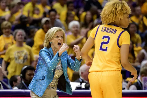 LSU head coach Kim Mulkey, left, reacts next to LSU guard Jasmine Carson (2) in the first half of an NCAA college basketball game against Mississippi State, Sunday, Feb. 26, 2023, in Baton Rouge, La. (AP Photo/Matthew Hinton)