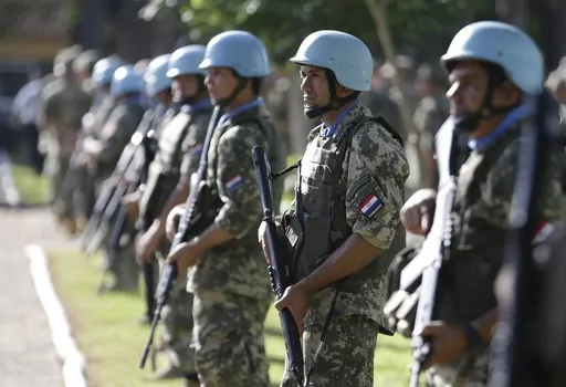 Soldiers line up at the United Nations Peace Operations Training Center (CECOPAZ) before the arrival of United Nations Secretary-General Ban Ki-Moon in Asuncion, Paraguay, on Feb. 26, 2015. The organization is marking the 75th anniversary of U.N. peacekeeping and observing the International Day of United Nations Peacekeepers on Thursday, May 25, 2023. (AP Photo/Jorge Saenz, File)