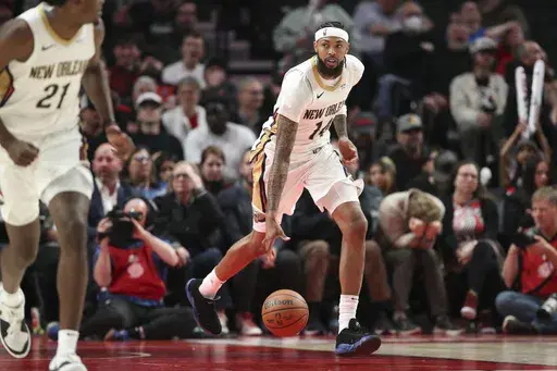 New Orleans Pelicans forward Brandon Ingram (14) brings the ball up court against the Portland Trail Blazers during the second half of an NBA basketball game Friday, Oct. 25, 2024, in Portland, Ore. The Pelicans won 105-103. (AP Photo/Amanda Loman)