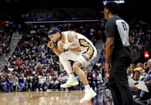 New Orleans Pelicans guard Jose Alvarado, left, reacts after missing a 3-point basket against the Orlando Magic in the first half of an NBA basketball game in New Orleans, Monday, Feb. 27, 2023. (AP Photo/Derick Hingle)