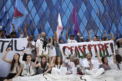 Demonstrators participate in a protest against the Israel-Hamas war during the COP28 U.N. Climate Summit, Sunday, Dec. 3, 2023, in Dubai, United Arab Emirates. (AP Photo/Peter Dejong)