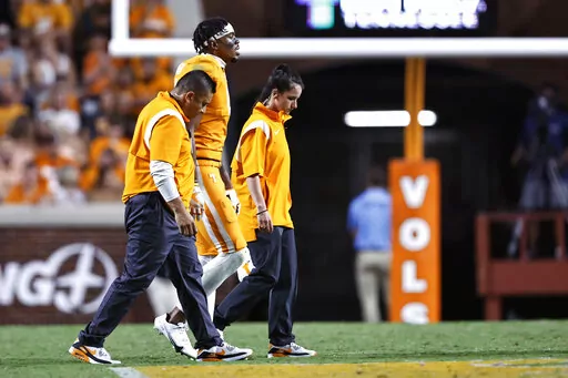 Tennessee wide receiver Cedric Tillman walks off the field after being injured during the first half of an NCAA college football game against Akron on Sept. 17, 2022, in Knoxville, Tenn. Tennessee coach Josh Heupel said Monday, Oct. 3, that Tillman had surgery on his left ankle to speed up recovery from an injury. (AP Photo/Wade Payne, File)