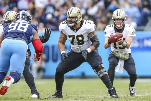 New Orleans Saints center Erik McCoy (78) sets to block during the team's NFL football game against the Tennessee Titans in Nashville, Tenn., Nov. 14, 2021. McCoy has agreed to a five-year contract extension reportedly worth about $63.8 million. McCoy’s representatives at APEX Sports Group announced the agreement in a social media post on Thursday, Sept. 8, 2022. The deal comes as McCoy enters the final season of his rookie contract. (AP Photo/Gary McCullough, File)