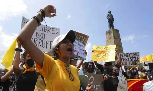 Sri Lankans protest demanding president Gotabaya Rajapaksa resign in Colombo, Sri Lanka, Monday, April 4, 2022. Sri Lanka's president on Monday invited all political parties represented in Parliament to accept ministries after his Cabinet resigned amid public protests over the country's worst economic crisis. Disruptions to supplies of commodities, financial strains and higher prices are among the shocks from the war in Ukraine that will slow economies in Asia in coming months, the World Bank sa