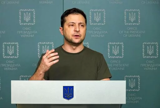 In this photo, Feb. 27, 2022, taken from video provided by the Ukrainian Presidential Press Office, Ukrainian President Volodymyr Zelenskyy speaks to the nation in Kyiv, Ukraine.  Russian state media is spreading false claims that Ukrainian President Volodymyr Zelenskyy has fled Kyiv in what experts say is an effort to discourage Ukrainians and erode support for Ukraine around the globe.  (Ukrainian Presidential Press Office via AP, File)
