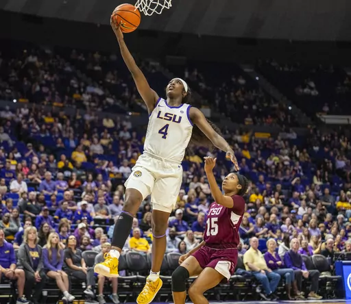 LSU guard Flau'jae Johnson (4) finishes a layup against Texas Southern in the first period of an NCAA college basketball game Monday, Nov. 20, 2023, in Baton Rouge, La. (Michael Johnson/The Advocate via AP)