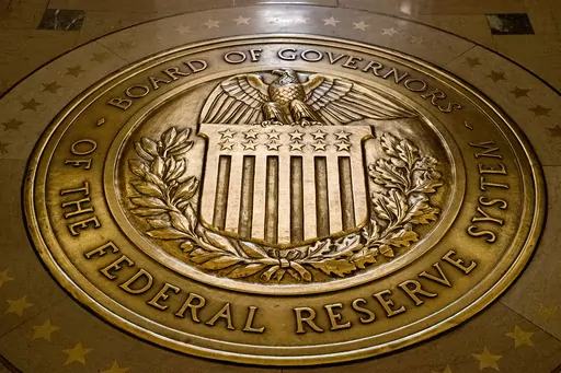 The seal of the Board of Governors of the United States Federal Reserve System is displayed in the ground at the Marriner S. Eccles Federal Reserve Board Building in Washington, Feb. 5, 2018. On Friday, April 14, 2023, The Associated Press reported on stories circulating online incorrectly claiming that a new Federal Reserve digital app, FedNow, will eliminate physical cash. (AP Photo/Andrew Harnik, File)
