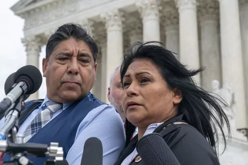 Beatriz Gonzalez, right, the mother of 23-year-old Nohemi Gonzalez, a student killed in the Paris terrorist attacks, and stepfather Jose Hernandez, speak outside the Supreme Court, Feb. 21, 2023, in Washington. The Supreme Court on Thursday, May 18, sidestepped a case against Google that might have allowed more lawsuits against social media companies. The justices' decision returns to a lower court the case from the family of Nohemi Gonzalez. The family wants to sue Google for YouTube videos the