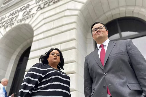 Priscilla Villarreal, an online journalist from Laredo, Texas, stands outside the 5th U.S. Circuit Court of Appeals building in New Orleans on Wednesday, Jan. 25, 2023, with her attorney, J.T. Morris, after the court heard arguments in Villarreal's lawsuit against Laredo and Webb County, Texas, authorities. Her suit says she was wrongfully arrested by Laredo and Webb County authorities in 2017 for seeking information from police. The criminal charge against her was dismissed by a Texas judge in 