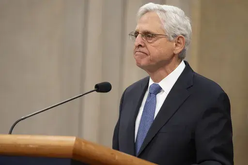 Attorney General Merrick Garland reacts during a farewell ceremony at the Department of Justice, Thursday, Jan. 16, 2025, in Washington. (AP Photo/Mark Schiefelbein)