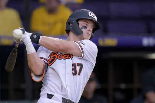 Oregon State infielder Travis Bazzana (37) bats during an NCAA baseball game on Friday, June 2, 2023, in Baton Rouge, La. The second baseman from Australia rides momentum into the season. (AP Photo/Matthew Hinton, File)