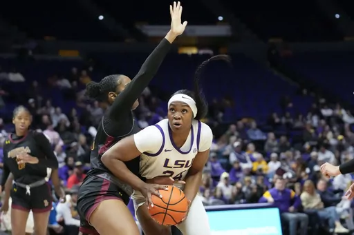 LSU forward Aneesah Morrow (24) drives to the basket in the first half an NCAA college basketball exhibition game against Loyola New Orleans in Baton Rouge, La., Wednesday, Nov. 1, 2023. Aneesah Morrow is the Associated Press national player of the week in women's college basketball. She led LSU to three wins last week, averaging 27.3 points and 10 rebounds. (AP Photo/Gerald Herbert, File)