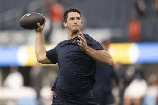 Then-Chicago Bears quarterback Nathan Peterman (14) warms up before an NFL football game against the Los Angeles Chargers, Sunday, Oct. 29, 2023, in Inglewood, Calif. (AP Photo/Kyusung Gong, File)