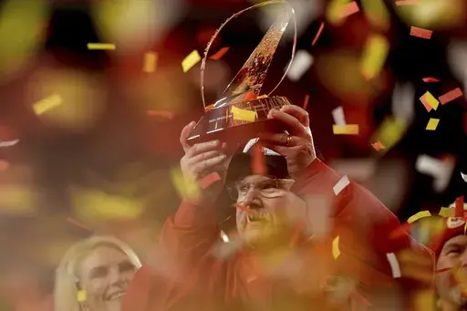 Kansas City Chiefs head coach Andy Reid holds the Lamar Hunt Trophy after the Chiefs defeated the Buffalo Bills in the AFC Championship NFL football game, Sunday, Jan. 26, 2025, in Kansas City, Mo. (AP Photo/Charlie Riedel)