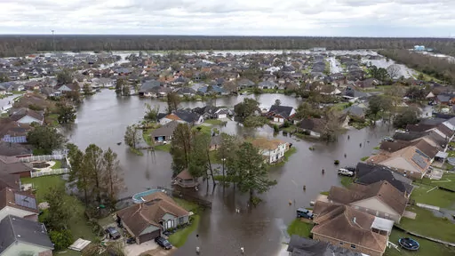 Flooded streets and homes are shown in the Spring Meadow subdivision in LaPlace, La., after Hurricane Ida moved through Aug. 30, 2021. The Department of Housing and Urban Development is allocating nearly $3 billion in disaster relief to cover recovery efforts by multiple state and local governments. The Community Development Block Grants, announced Tuesday, March 22, 2022, are going to 10 local governments and 13 state governments for 16 major disasters that took place in 2021. (AP Photo/Steve H