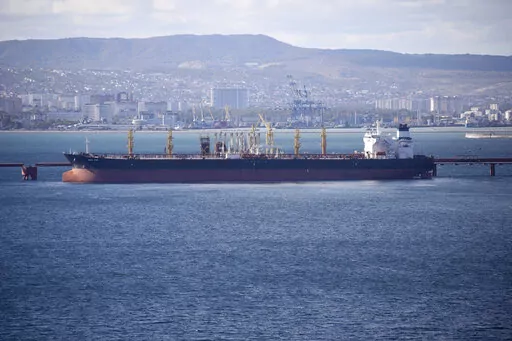 An oil tanker is moored at the Sheskharis complex, part of Chernomortransneft JSC, a subsidiary of Transneft PJSC, in Novorossiysk, Russia, on Oct. 11, 2022. A Russian official says the country will will cut oil production by 500,000 barrels per day next month in response to the West capping the price of its crude over the war in Ukraine. According to multiple Russian news media reports, Deputy Prime Minister Alexander Novak said Friday, Feb. 10, 2023 that “we will not sell oil to those who di