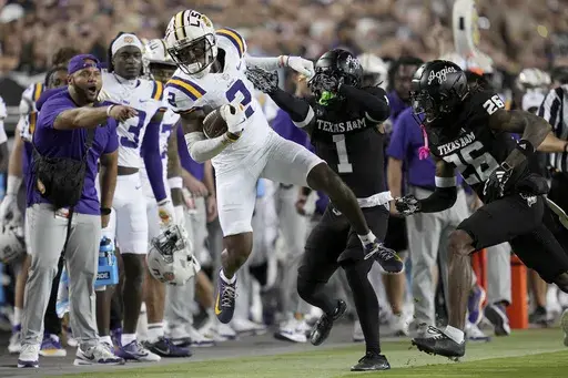 LSU wide receiver Kyren Lacy (2) is pushed out of bounds after 21 yard catch and run by Texas A&M defensive back Bryce Anderson (1) during the first half of an NCAA college football game Saturday, Oct. 26, 2024, in College Station, Texas. (AP Photo/Sam Craft)