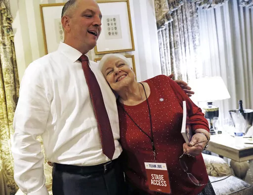 Louisiana Democratic gubernatorial candidate Rep. John Bel Edwards hugs his mother Dora Jean Edwards as he watches election returns in a hotel suite at his election night watch party in New Orleans, Saturday, Nov. 21, 2015. Dora Jean Edwards, the mother of Louisiana Gov. John Bel Edwards, has died, the governor announced in a Friday, Jan. 20, 2023. (AP Photo/Gerald Herbert, File)