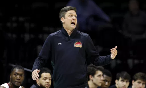 Loyola-New Orleans coach Stacy Hollowell reacts during the first half of the team's NAIA men's championship college basketball game against Talladega on March 22, 2022, in Kansas City, Mo. The University of New Orleans has hired Hollowell as basketball coach. Two years ago, Hollowell coached Loyola to an NAIA championship. Following that season, he joined the staff of then-Mississippi coach Kermit Davis, but left Ole Miss in 2023 after Davis was fired. (AP Photo/Colin E. Braley, File)