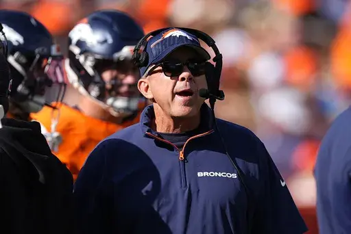 Denver Broncos head coach Sean Payton looks on during the first half of an NFL football game against the Los Angeles Chargers, Sunday, Oct. 13, 2024, in Denver. (AP Photo/David Zalubowski)