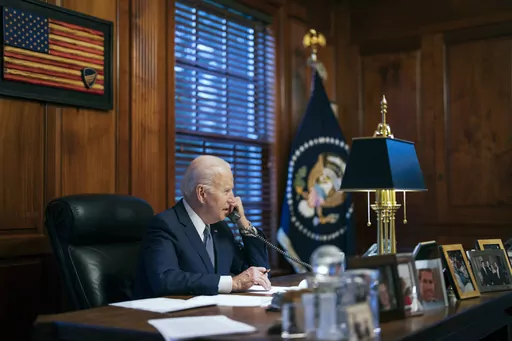 In this image provided by The White House, President Joe Biden speaks with Russian President Vladimir Putin on the phone from his private residence in Wilmington, Del., Dec. 30, 2021. Biden's sprawling home outside downtown Wilmington, has a special place in his heart. When he met special prosecutor Robert Hur to talk about the sensitive documents he’d improperly kept after his vice presidency, Biden told Hur three times he is a “frustrated architect.” (Adam Schultz/The White House via AP,