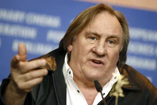 Actor Gerard Depardieu addresses the media during the press conference for the film 'Saint Amour' at the 2016 Berlinale Film Festival in Berlin, Germany, on Feb. 19, 2016. (AP Photo/Axel Schmidt, File)