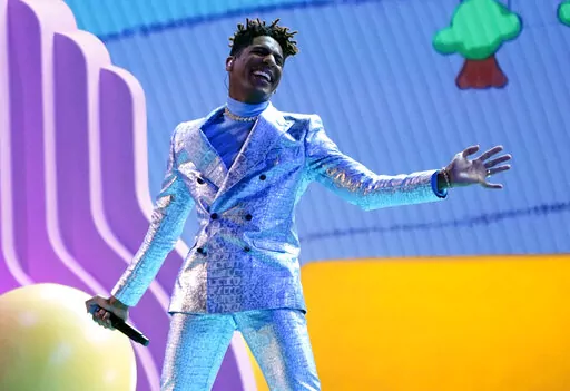 Jon Batiste performs "Freedom" at the 64th Annual Grammy Awards on Sunday, April 3, 2022, in Las Vegas. (AP Photo/Chris Pizzello)