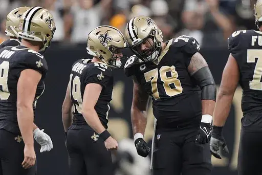 New Orleans Saints place-kicker Blake Grupe (19) is congratulated by center Erik McCoy (78) after a field goal during the first half of an NFL football game against the Carolina Panthers, Sunday, Sept. 8, 2024, in New Orleans. (AP Photo/Gerald Herbert)