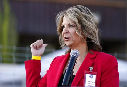 In this Nov. 18, 2020, photo, Kelli Ward, chair of the Arizona Republican Party, holds a new conference in Phoenix. The House committee investigating the U.S. Capitol insurrection has subpoenaed six individuals over efforts to falsely declare Donald Trump the winner of the 2020 election in several swing states. (AP Photo/Ross D. Franklin, File)