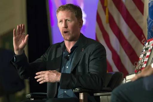 FILE -- Former Navy SEAL Robert O'Neill, who claims to have fatally shot Osama Bin Laden, talks about joining the service at the Richard Nixon Presidential Library and Museum in Yorba Linda, Calif., Wednesday, July 26, 2017. O'Neill has a small ownership stake in Armed Forces Brewing Company and has served as its brand ambassador. His recent social media complaint about a Navy sailor who performs as a drag queen and a police report alleging he used a racial slur are fueling efforts to stop the b
