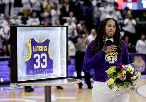 FILE -Seimone Augustus is honored by LSU in a ceremony prior to an NCAA college basketball game against South Carolina in Baton Rouge, Thursday, Jan. 6, 2022. Seimone Augustus has returned to LSU to join the women’s basketball staff as an assistant coach, Coach Kim Mulkey announced Monday, May 20, 2024.(AP Photo/Derick Hingle, File)