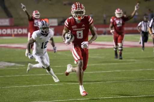 Louisiana wide receiver Michael Jefferson (8) scores a touchdown against Georgia Southern during an NCAA football game Nov. 10, 2022, in Lafayette, La. NFL prospect Jefferson was involved in a fatal car accident. Jefferson's agent, Jon Perzley, told ESPN that the player suffered injuries in the accident Sunday evening, April 9, 2023, that required multiple operations. Perzley did not immediately respond to an email sent by The Associated Press on Wednesday. (AP Photo/Matthew Hinton, File)