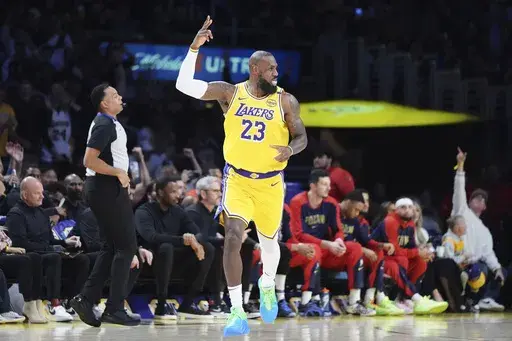 Los Angeles Lakers forward LeBron James celebrates after making a 3-point basket to go over the 50,000 career point mark during the first half of an NBA basketball game against the New Orleans Pelicans, Tuesday, March 4, 2025, in Los Angeles. (AP Photo/Jae C. Hong)