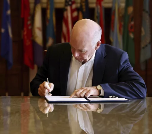 In this photo provided by the Montana Governor's Office, Republican Gov. Greg Gianforte signs a law banning TikTok in the state, May 17, 2023, in Helena, Mont. TikTok, Inc., filed a lawsuit Monday, May 22, 2023, seeking to overturn Montana's first-in-the-nation ban on the video sharing app, arguing the law is an unconstitutional violation of free speech rights and is based on “unfounded speculation” that the Chinese government could access users' data. (Garrett Turner/Montana Governor's Offi