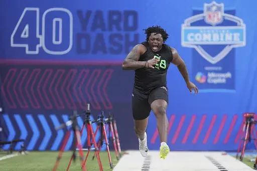 Missouri offensive lineman Armand Membou runs the 40-yard dash at the NFL football scouting combine in Indianapolis, Sunday, March 2, 2025. (AP Photo/Michael Conroy)