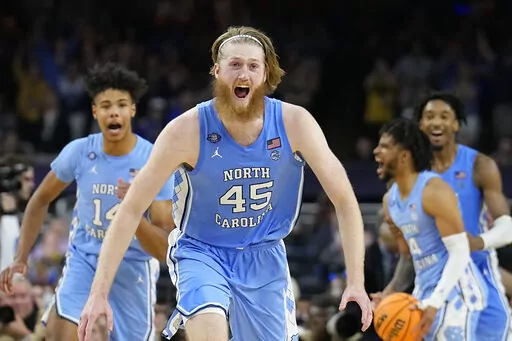 North Carolina's Brady Manek (45) celebrates after beating Duke in a college basketball game during the semifinal round of the Men's Final Four NCAA tournament, Saturday, April 2, 2022, in New Orleans. (AP Photo/David J. Phillip)