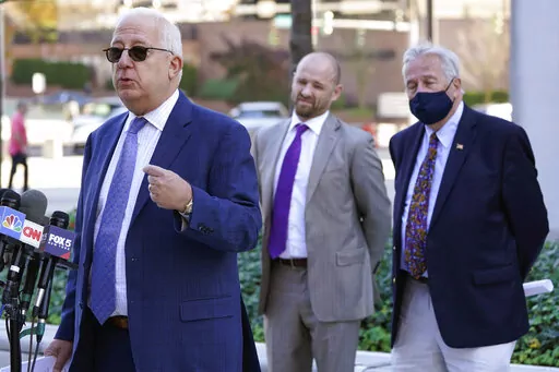 Attorney Robert Abrams, left, speaks during a news conference in White Plains, N.Y., Nov. 9, 2021. A quest for the fortune left behind by multimillionaire murderer Robert Durst is under way just days after his death. Abrams, a lawyer for the family of his missing first wife, notified the real estate tycoon's trust that it would be seeking more than $100 million from Durst's estate and widow. (AP Photo/Seth Wenig, File)
