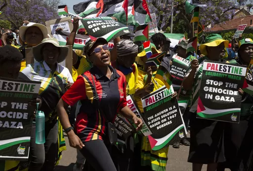 Pro-Palestinian supporters demonstrate at the entrance to the Israeli embassy in Pretoria, South Africa, on Oct. 20, 2023. South Africa's government has recalled Monday Nov. 6, 2023 its ambassador and diplomatic mission to Israel in condemnation of the bombardment of the Gaza Strip, calling it “a genocide”. (AP Photo/Denis Farrell, File)