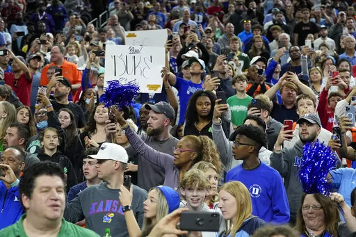 Fans cheer the Duke practice for the men's Final Four NCAA college basketball tournament, Friday, April 1, 2022, in New Orleans. (AP Photo/Gerald Herbert)